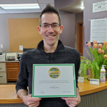 André holding the 2020 Angie's List Super Service Award received for Computer Repair and IT Services